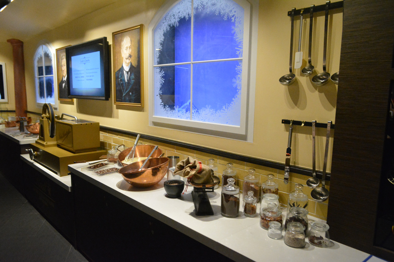Museum style exhibit of chocolate making equipment from a bygone age