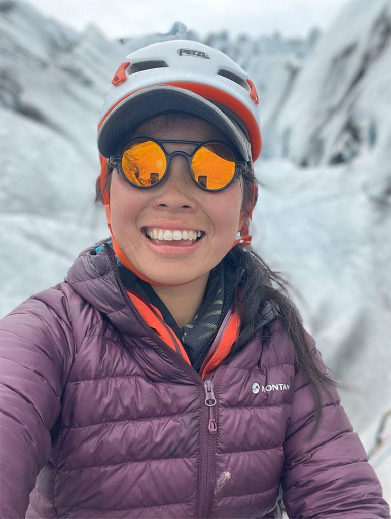 Female climber in purplejacket, white helmet and Vallon Heron Glacier Glasses in Iceland