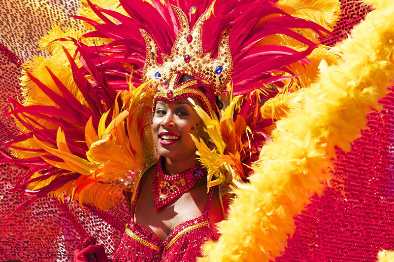 woman in red and yellow carnival costume